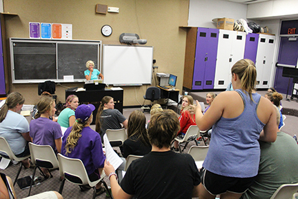 Alli Jones works on her solo with the chorus